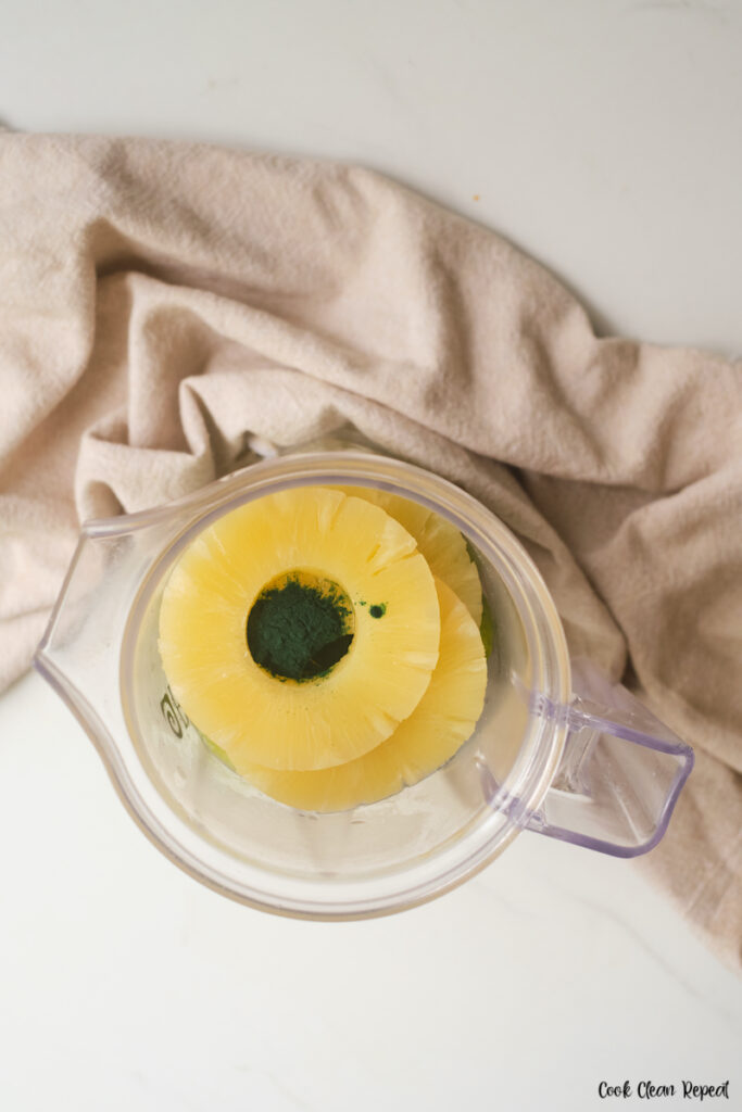 pineapple and greens powder added to blender