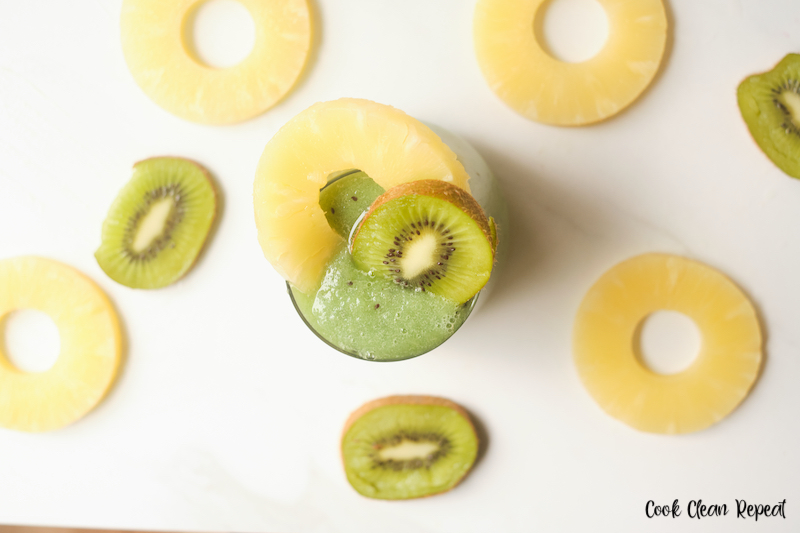 Featured image showing top down view of the finished mango pineapple kiwi smoothie