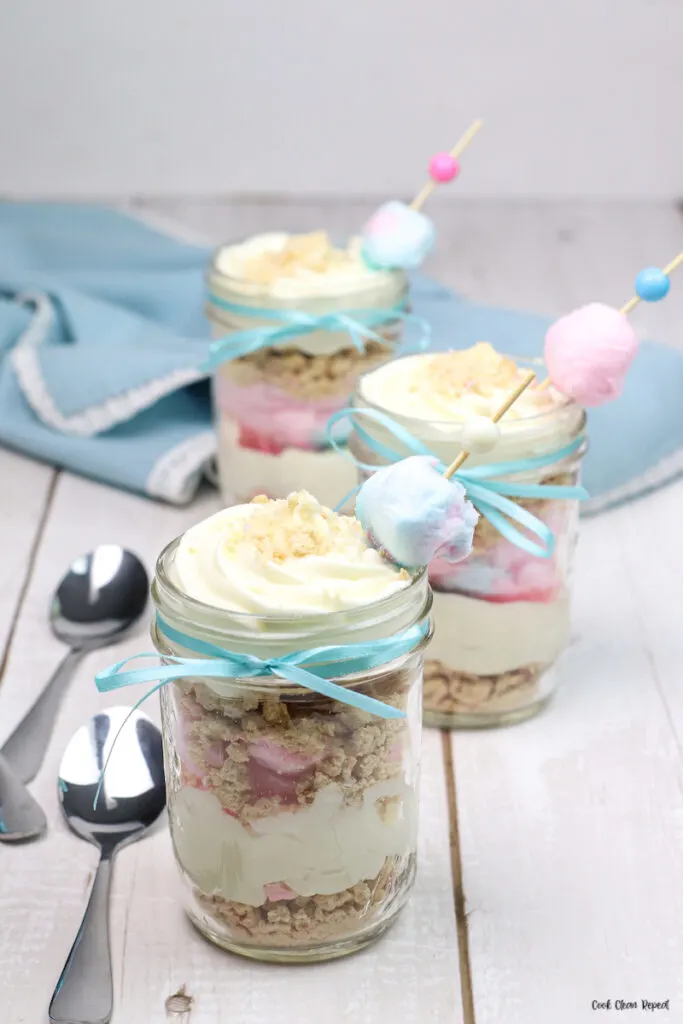 Finished cotton candy cheesecake recipe in jars ready to serve. 