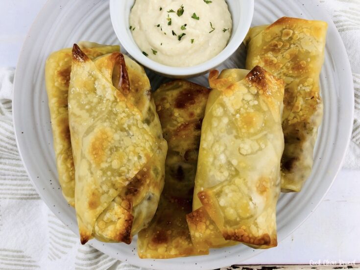 featured image showing the finished Philly cheesesteak egg rolls ready to eat.