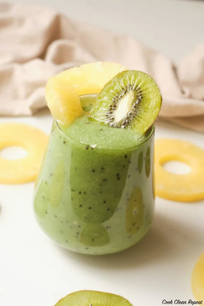 side view of the finished pineapple kiwi smoothie. 