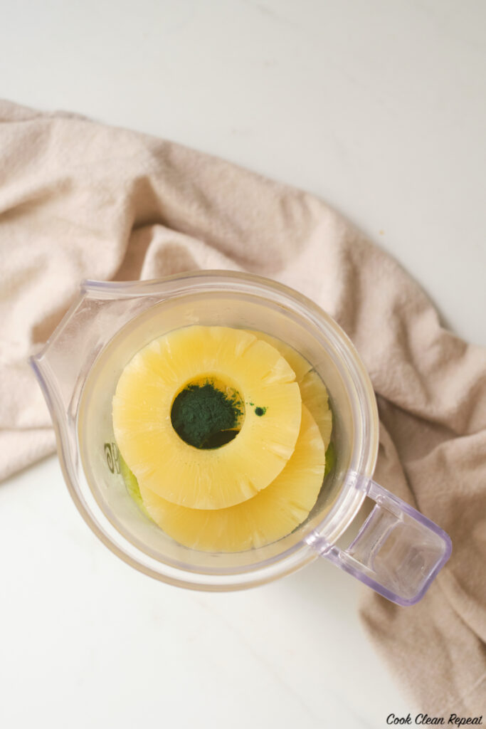 pineapple rings and greens powder added to the blender