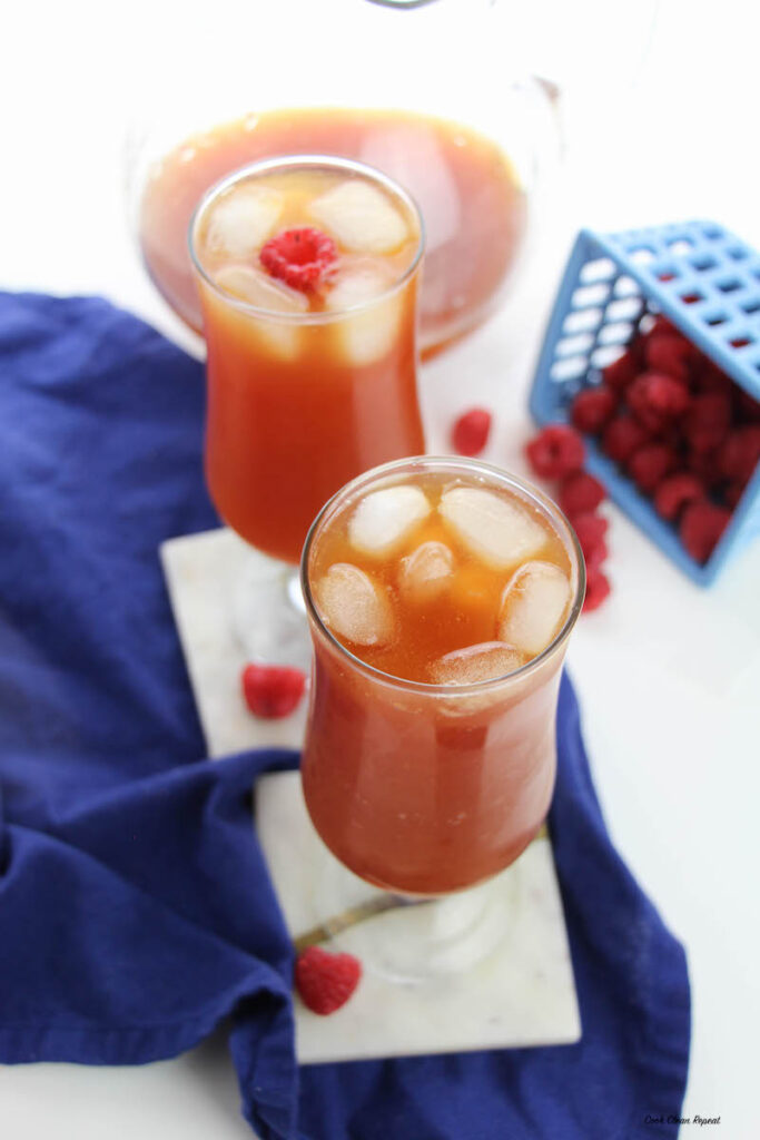 a top down look at two tall glasses of raspberry sweet tea ready to enjoy. 
