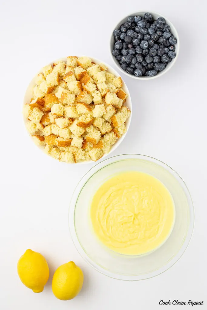 ingredients for blueberry lemon pudding cakes in a jar