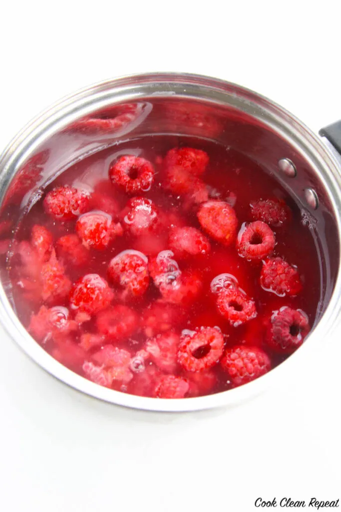 raspberry syrup ingredients in a pot ready to be strained and used for syrup