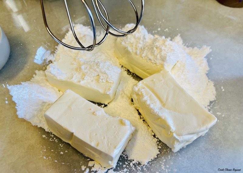 cream cheese and sugar in mixer ready to blend. 