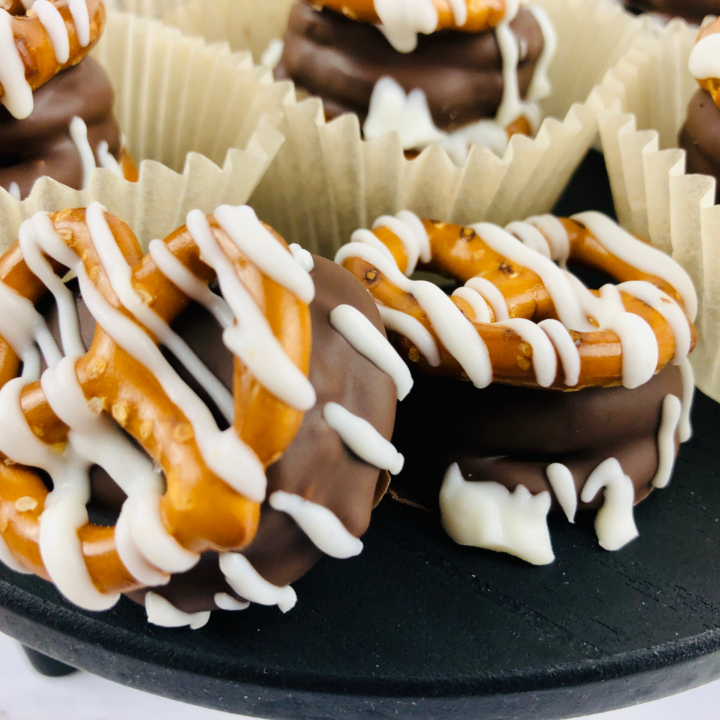 featured image showing finished almond bark dipped pretzels.