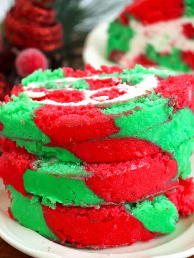 Stacked slices of finished Christmas cake roll.