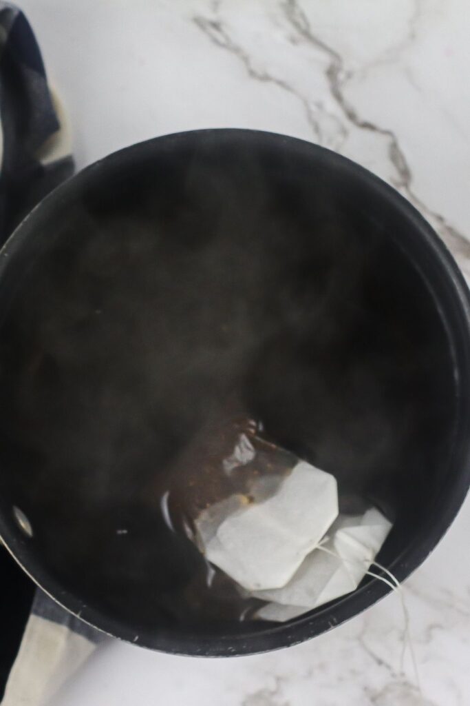 Tea bags simmering in hot water