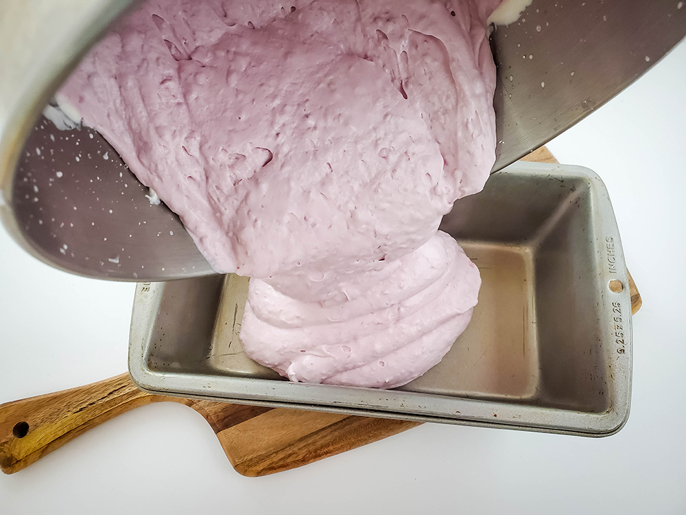An overhead view of the ice cream being poured into a mold.