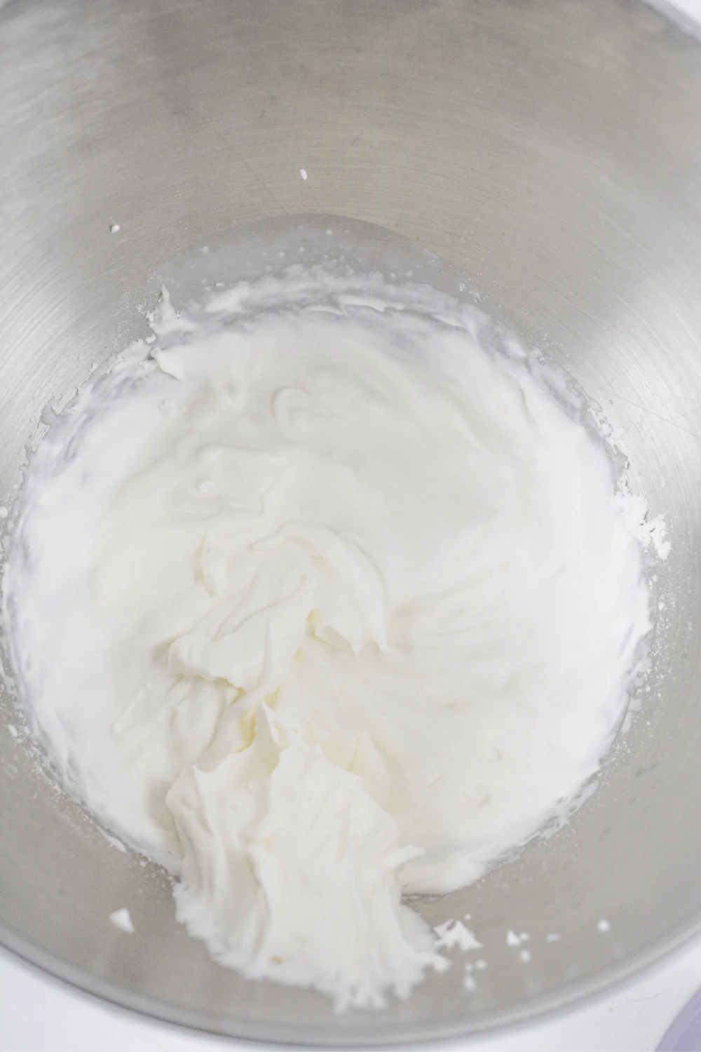 mixing cream cheese with swerve for strawberry cheesecake dessert recipe