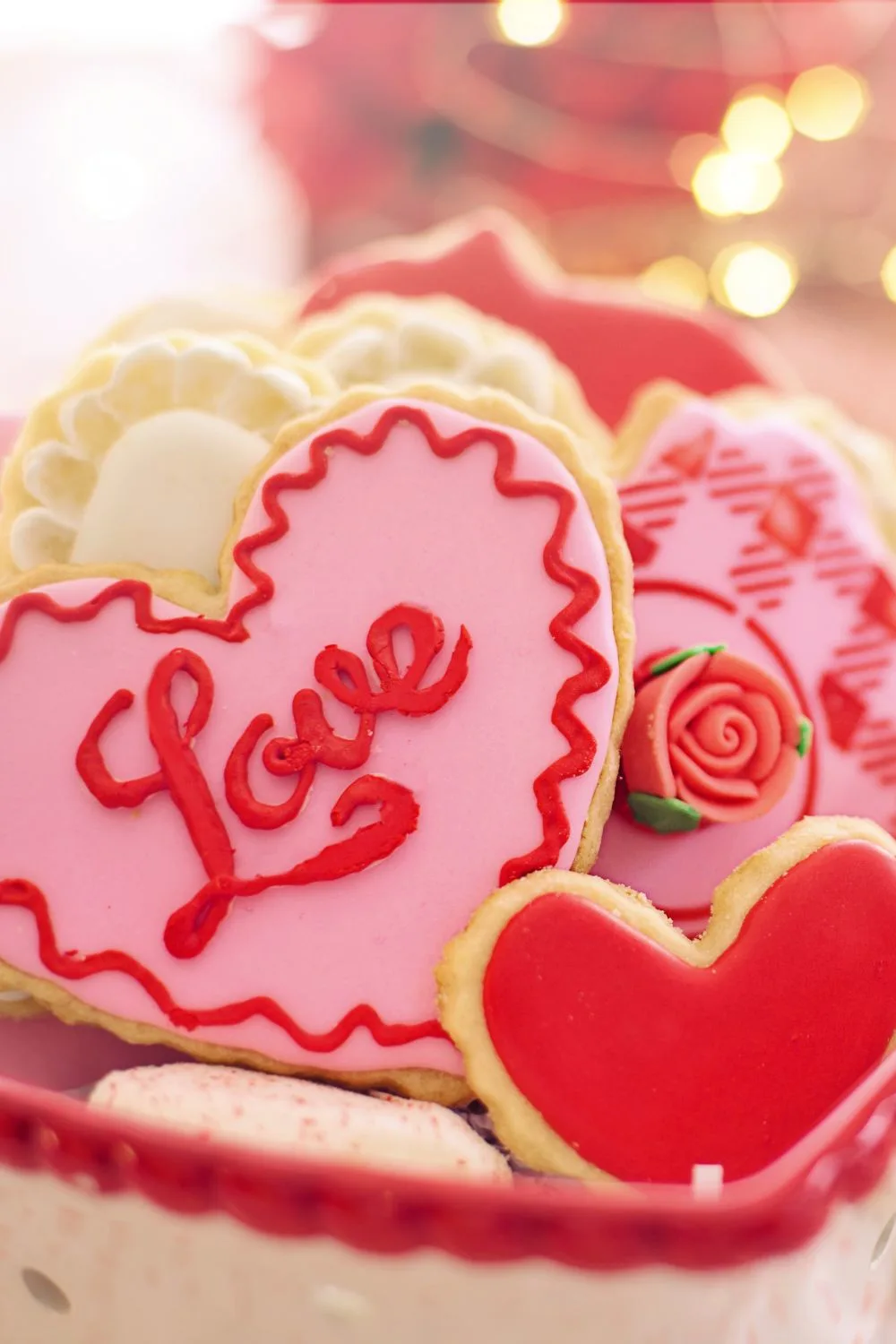 sugar cookies in the shape of hearts and decorated with icing
