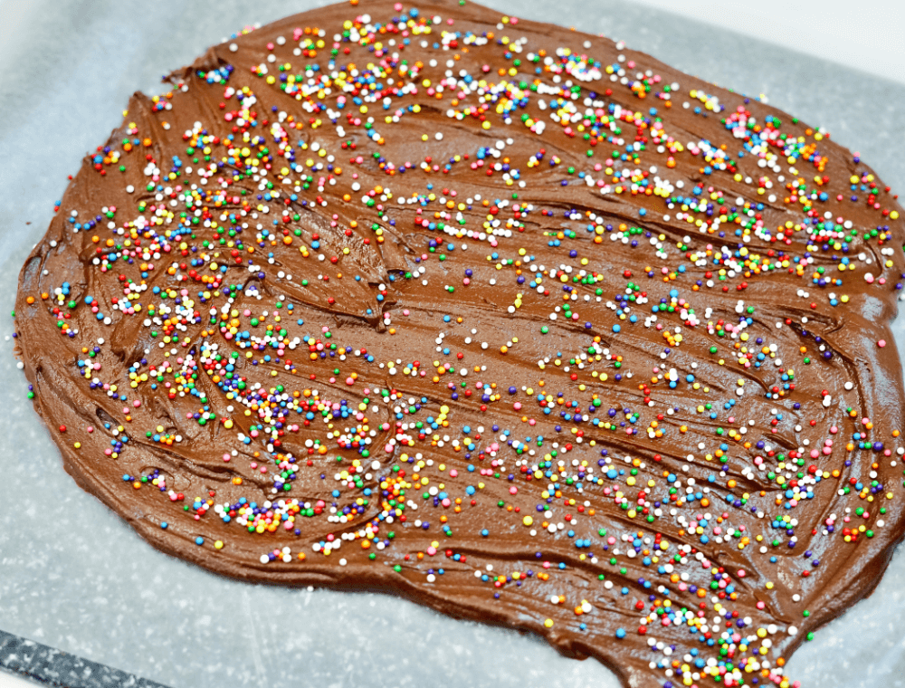 melted chocolate with sprinkles on wax paper