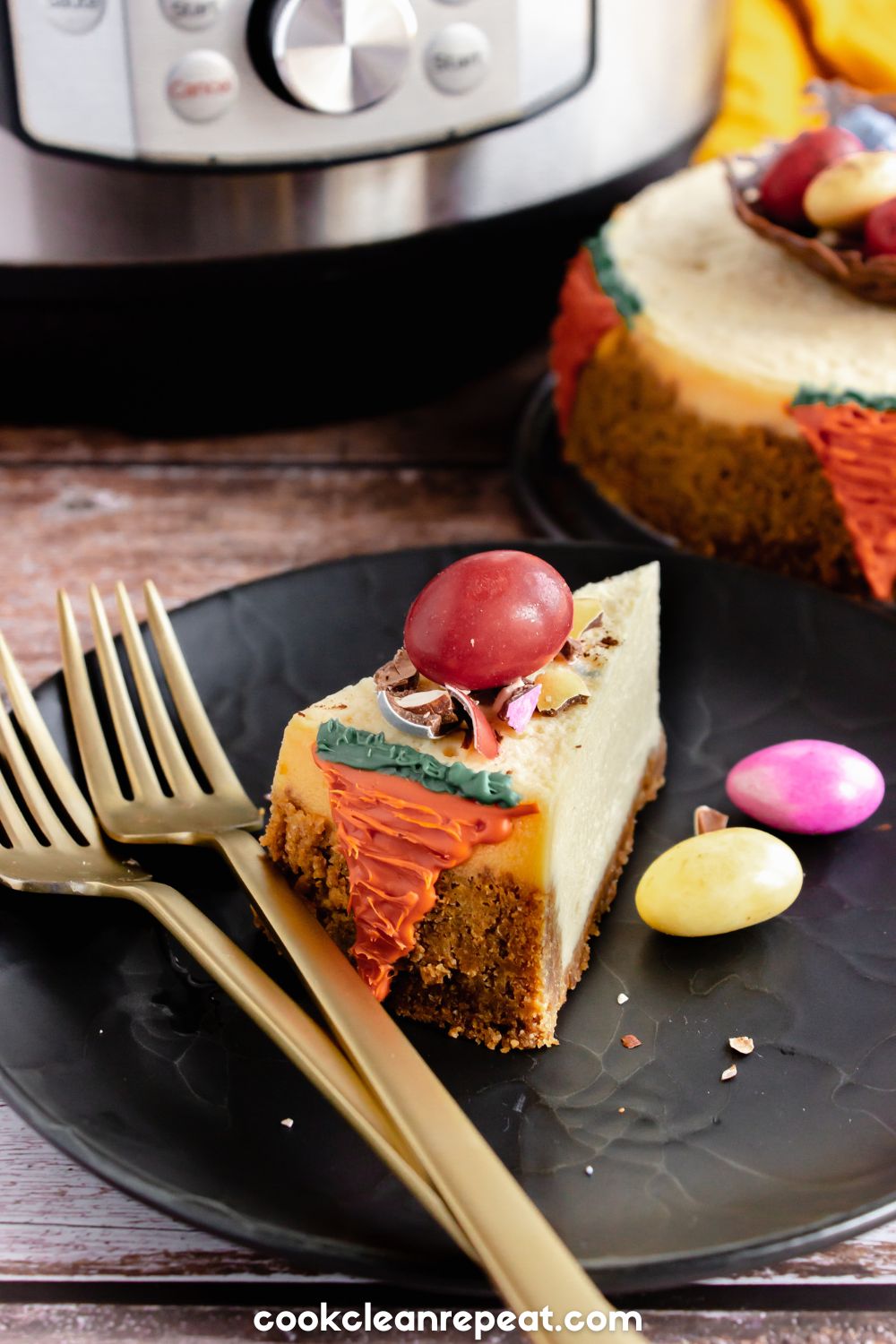 Slice of Easter cheesecake with chocolate eggs and forks beside it