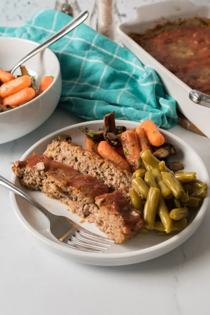 Easy meatloaf made with ground pork sausage, onions and spices.