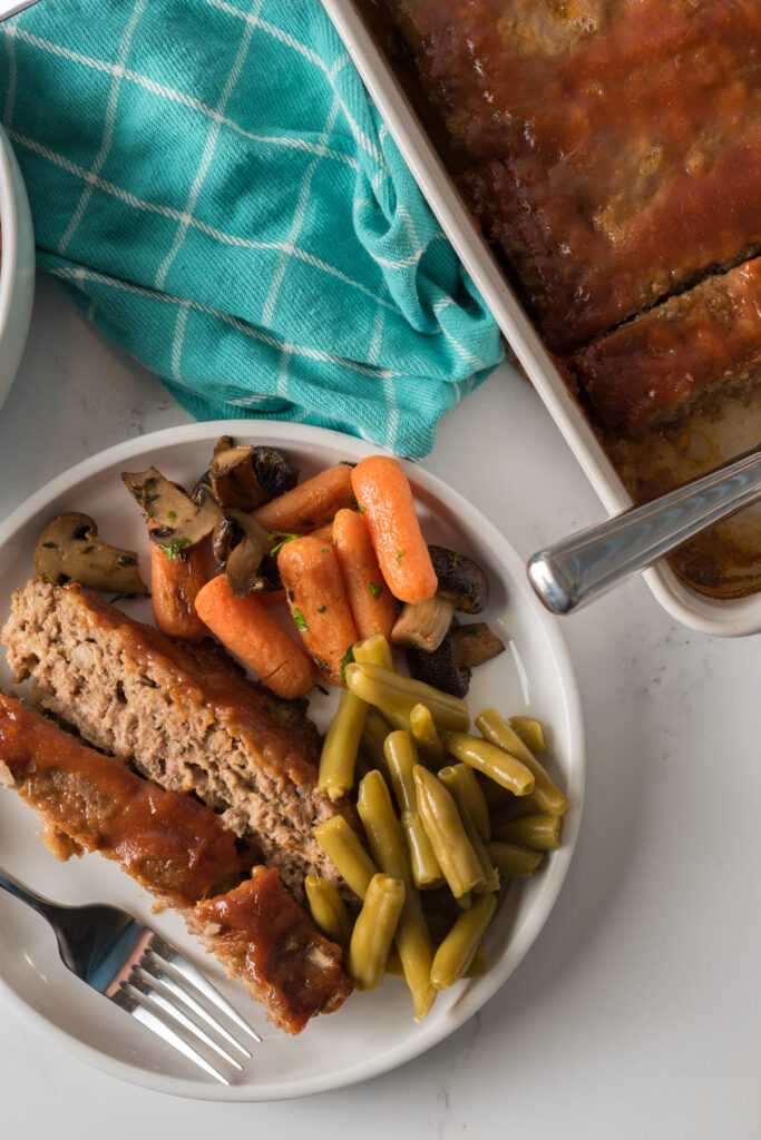 Easy meatloaf made with ground pork sausage, onions and spices.