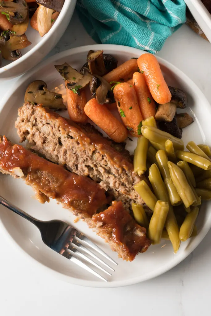 Easy meatloaf made with ground pork sausage, onions and spices.