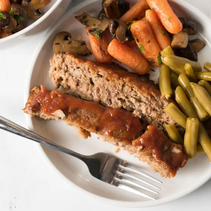 Easy meatloaf made with ground pork sausage, onions and spices.