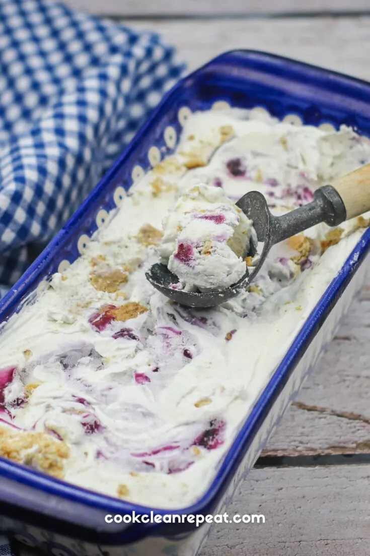 blueberry pie ice cream in a loaf dish being scooped