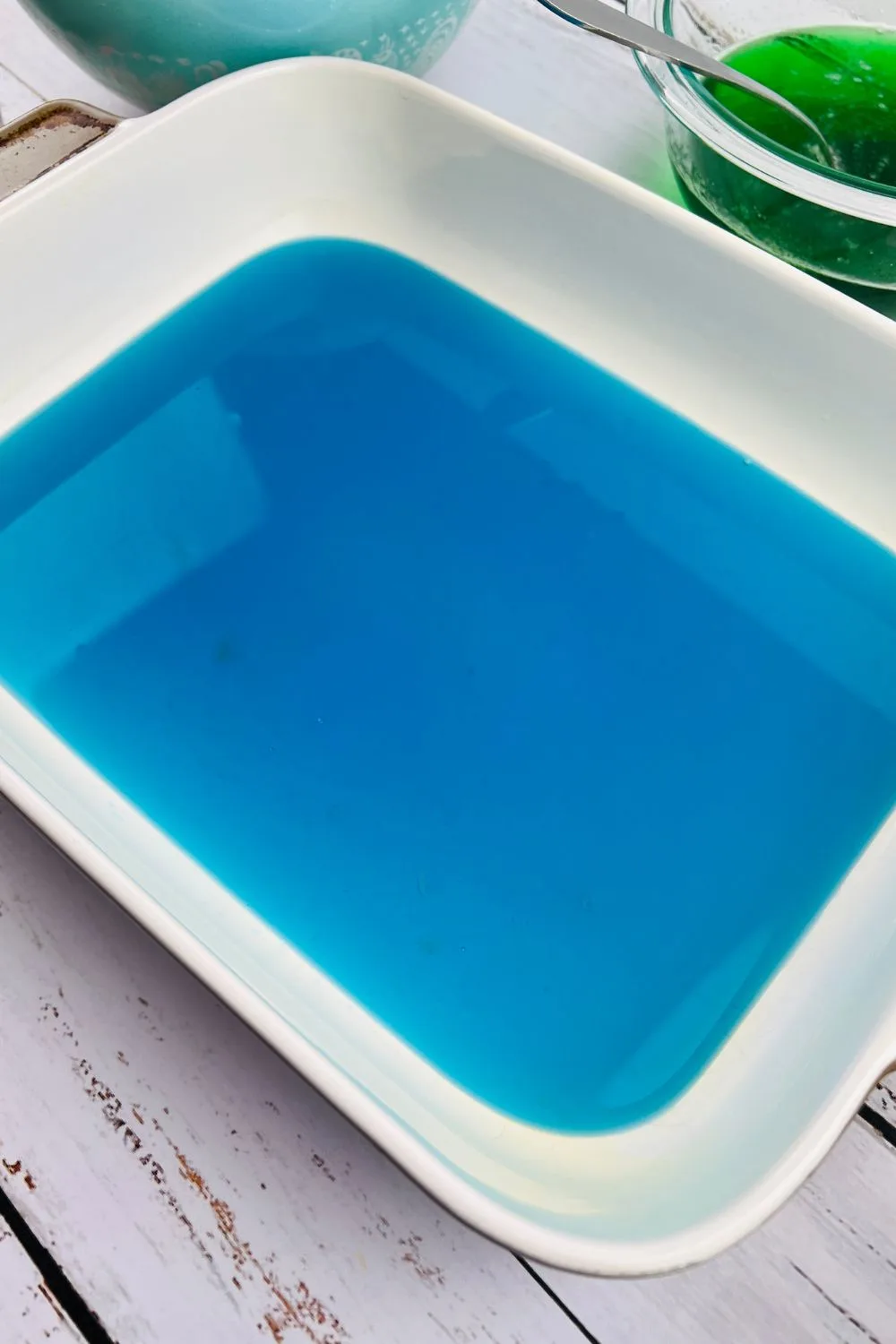 blue jello setting in a pan