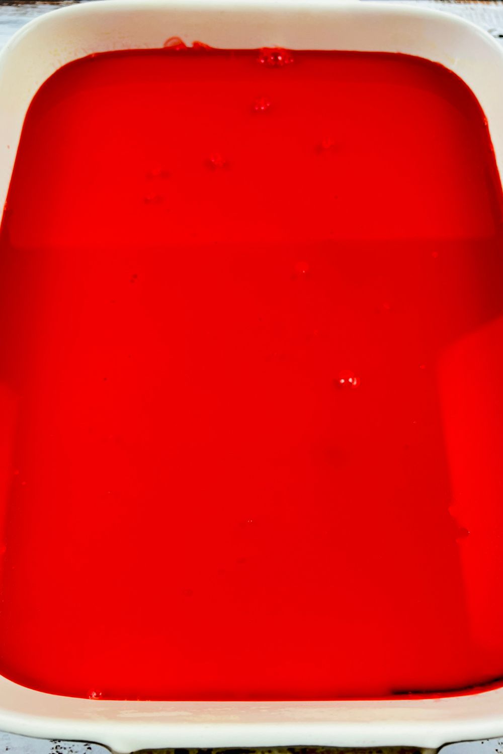 red jello setting in a pan