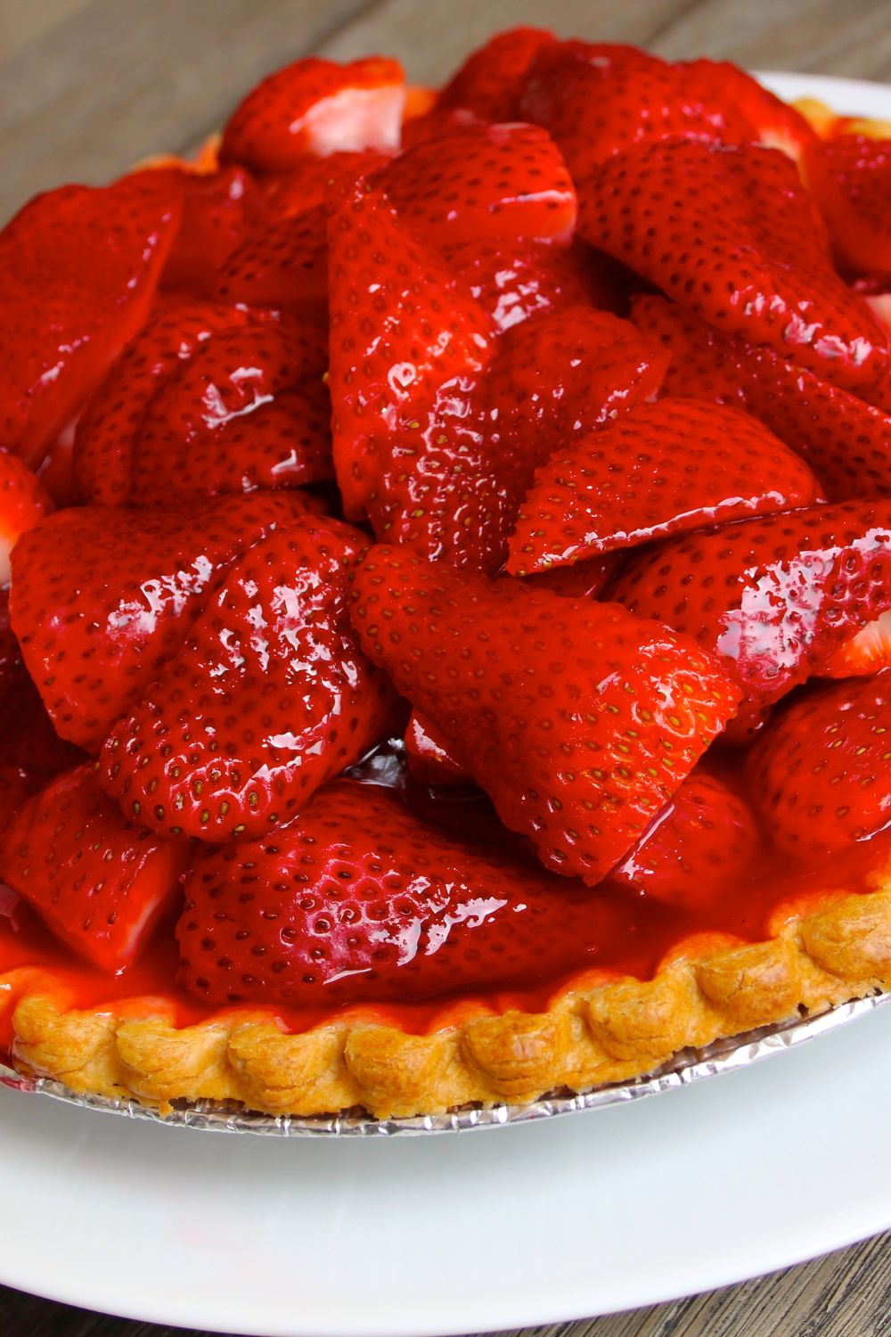 strawberries added into a pie shell