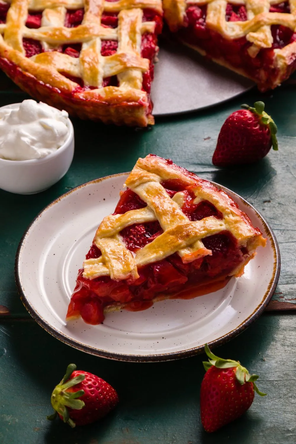 slice of strawberry pie with a lot of strawberry pie filling