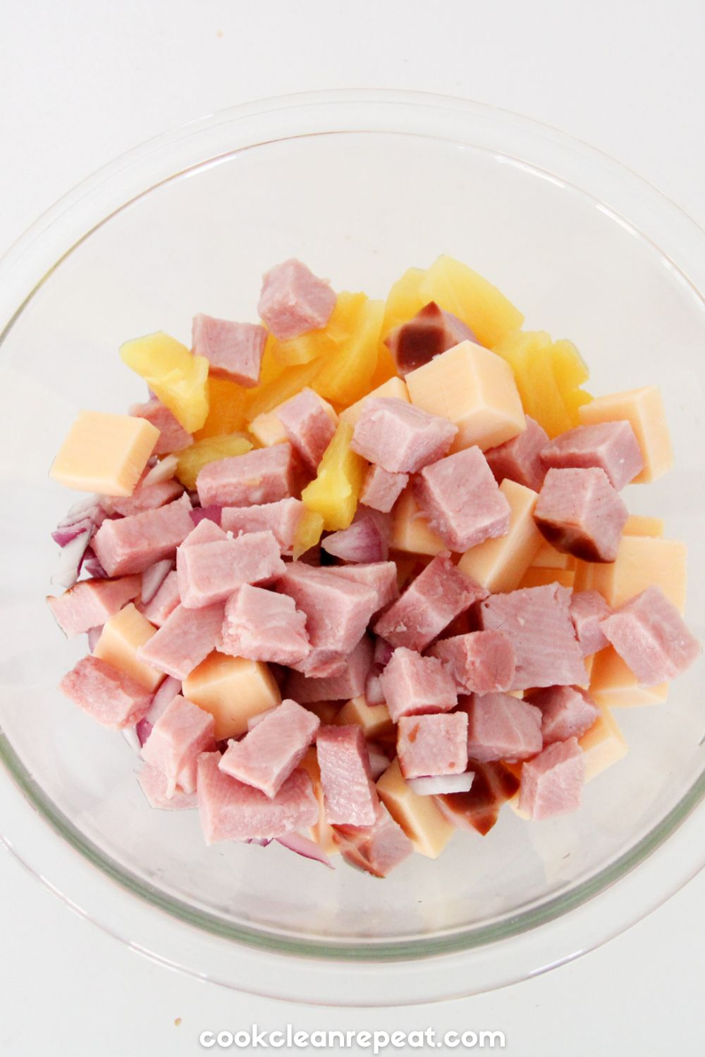ham, cheese and pineapple in a bowl