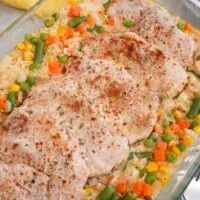 one pan with cooked pork chops and veggies