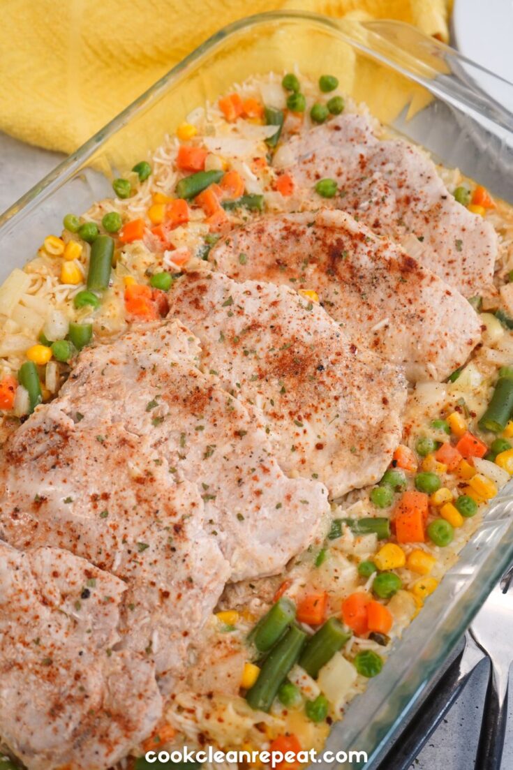 one pan with cooked pork chops and veggies