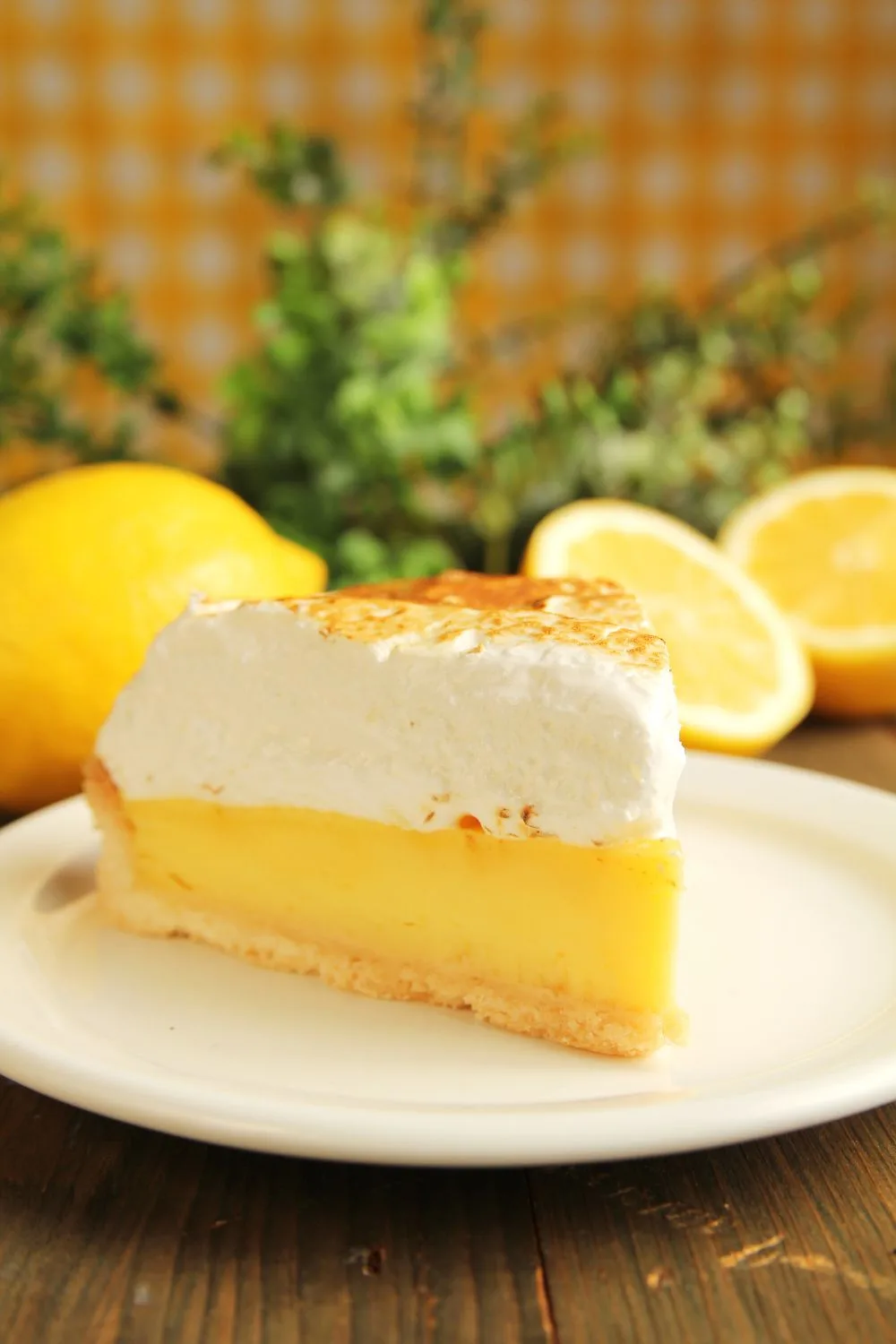 close up of a slice of lemon pie