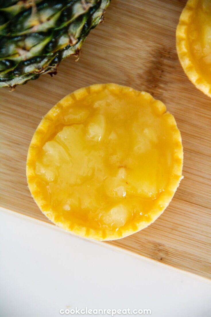 a close up of a pie crust with pineapple pie filling