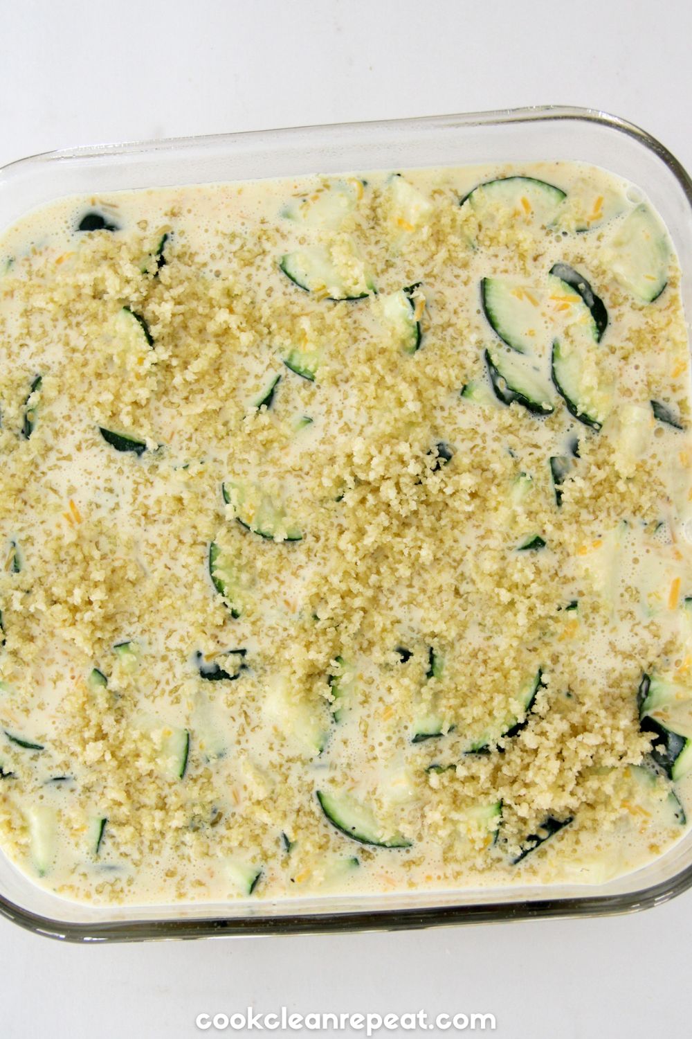 zucchini casserole in the casserole dish raw before being baked