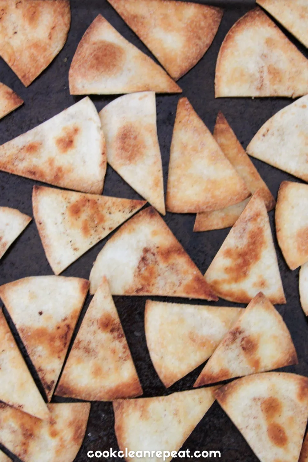 tortilla triangles on a baking sheet