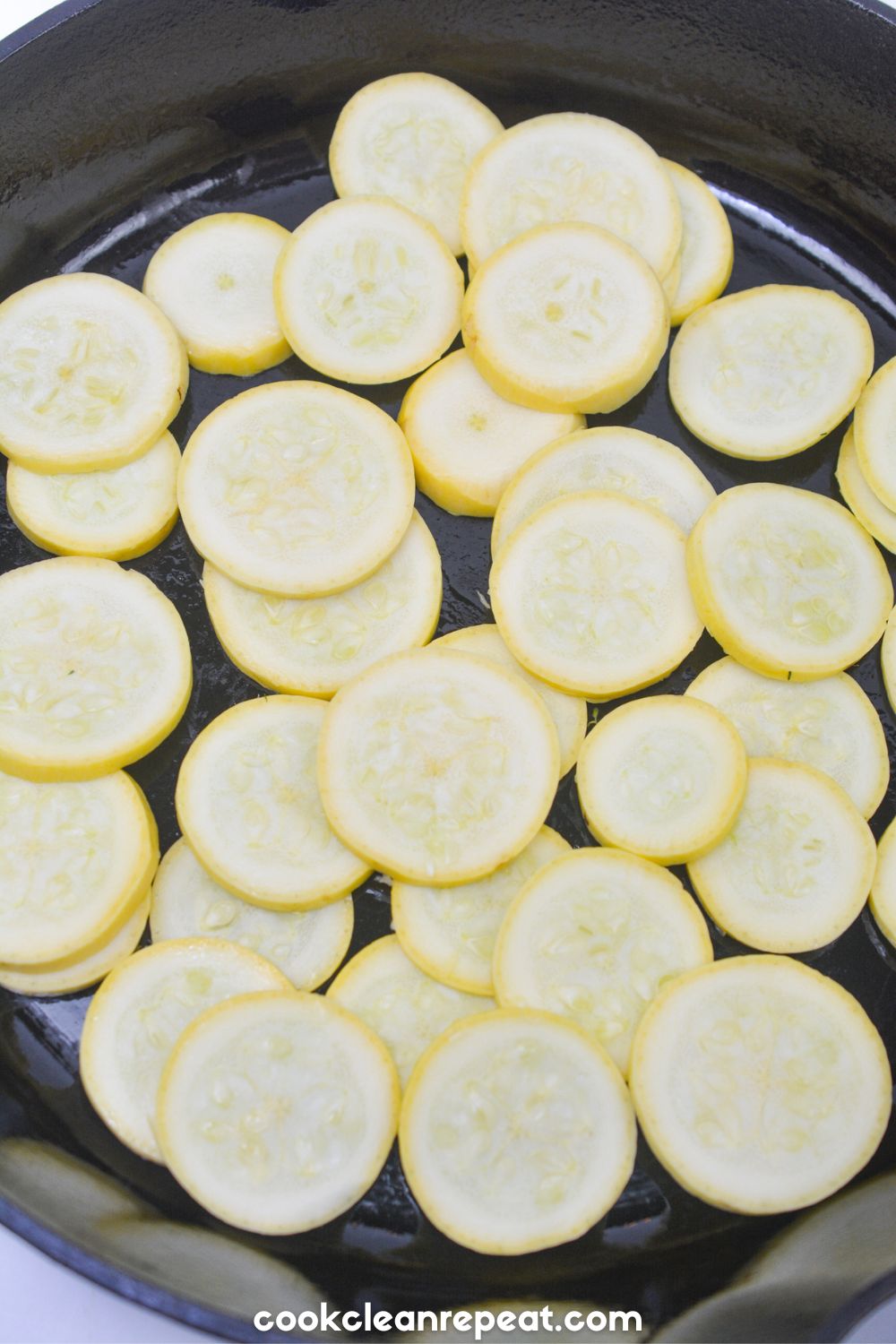 yellow squash slices on a skillet
