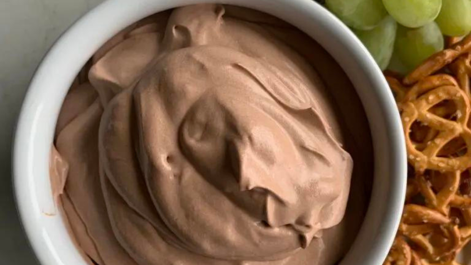 A bowl of rich and creamy chocolate pudding dip.