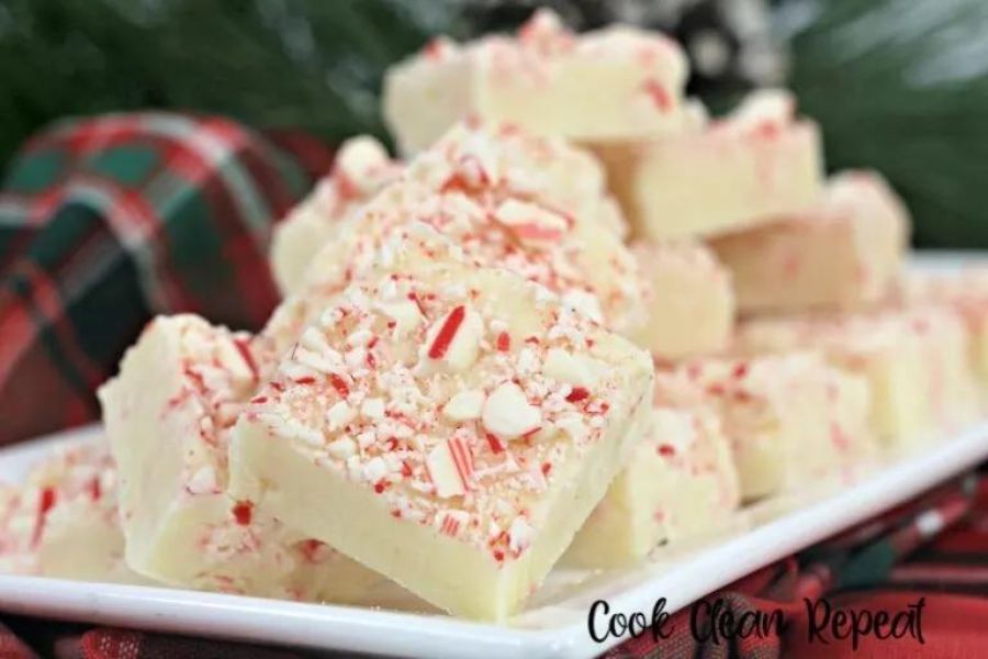 white chocolate fudge with crushed candy cane on top 
