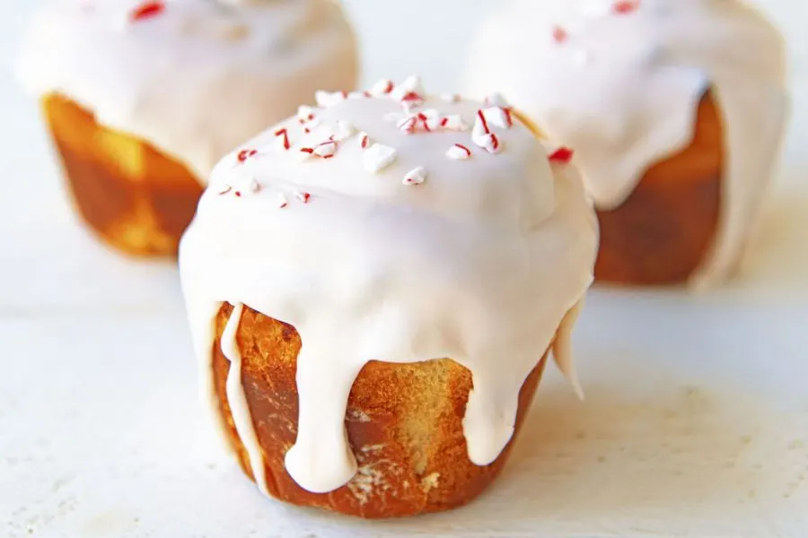 sweet rolls with melted white chocolate and crushed candy canes