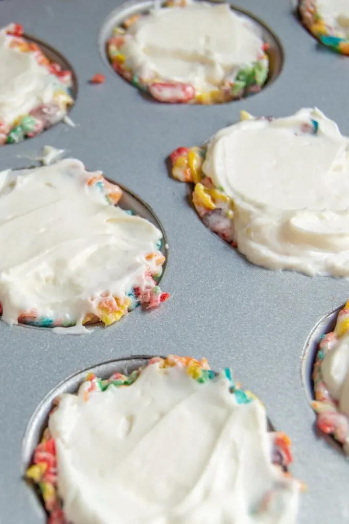 Fruity Pebbles Cheesecake Bites filled with cheesecake mix