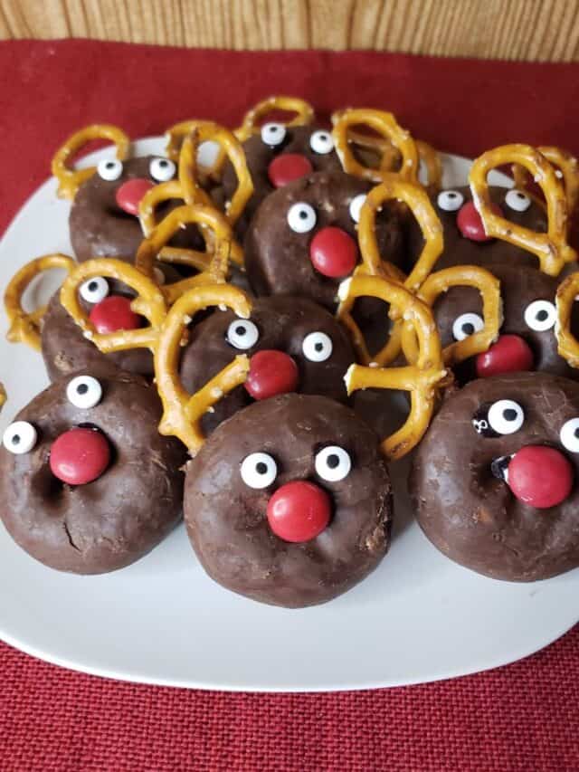 a pile of reindeer donuts on a plate