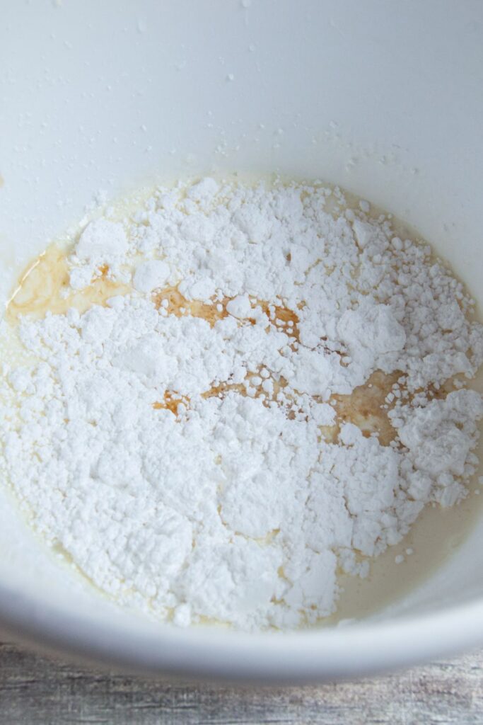 heavy whipping cream powdered sugar in a bowl