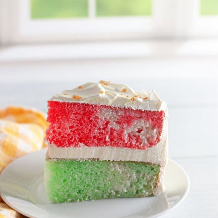 A slice of red and green Jello cake