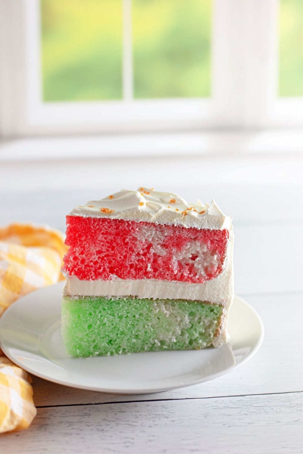 A slice of red and green Jello cake