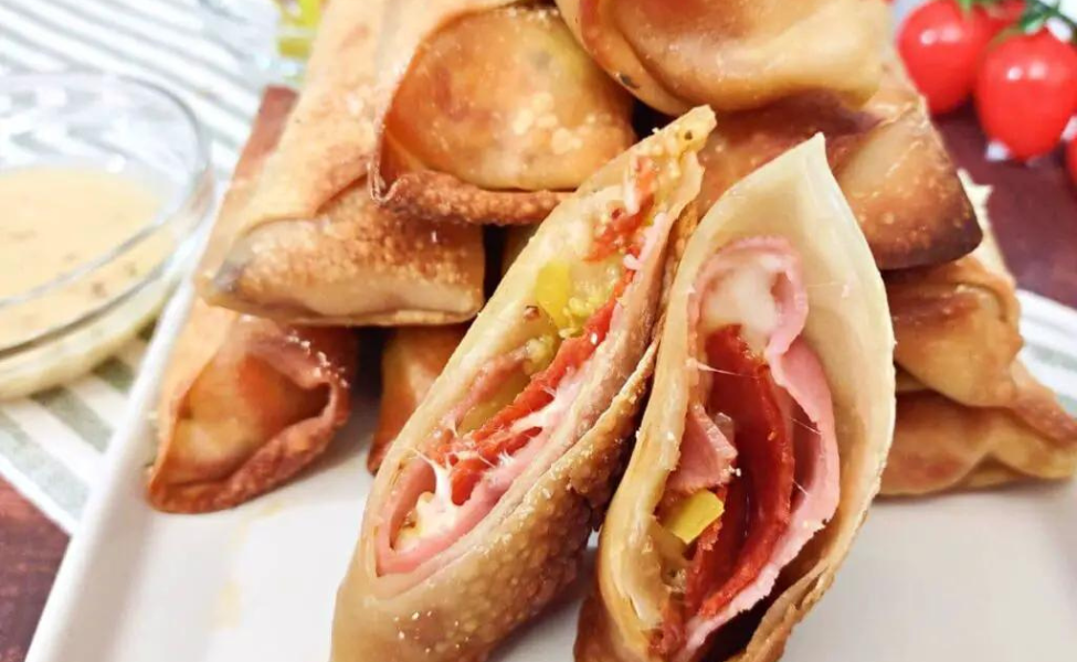  Egg rolls filled with peppers, Italian meats and cheese.