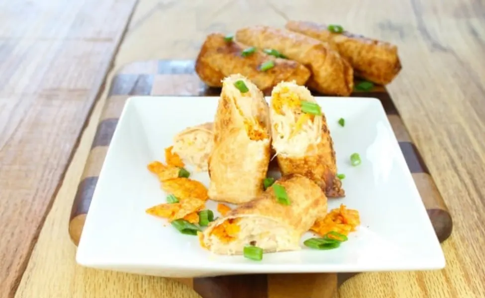 Egg rolls filled with doritos, chicken and cheese.