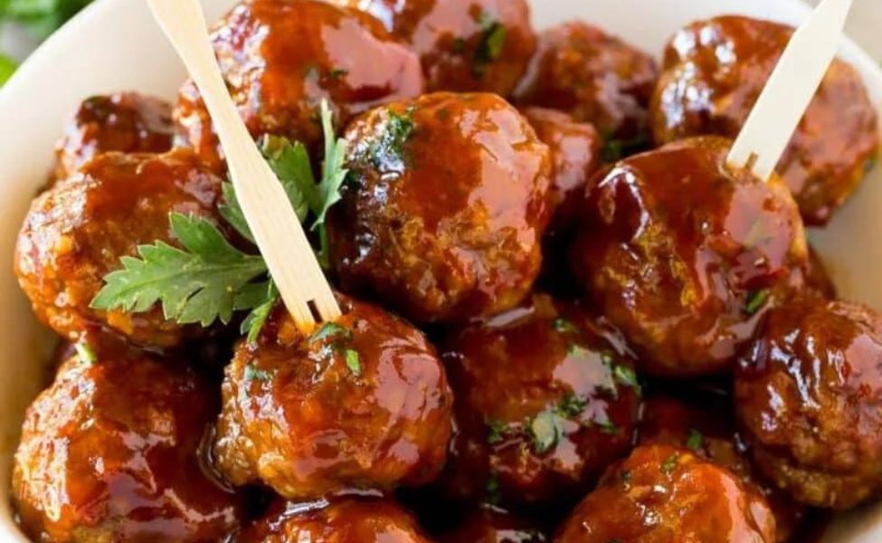 Meatballs made with grape jelly, in a bowl.