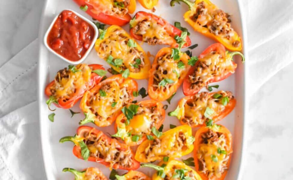 Mini peppers stuffed with taco filling.