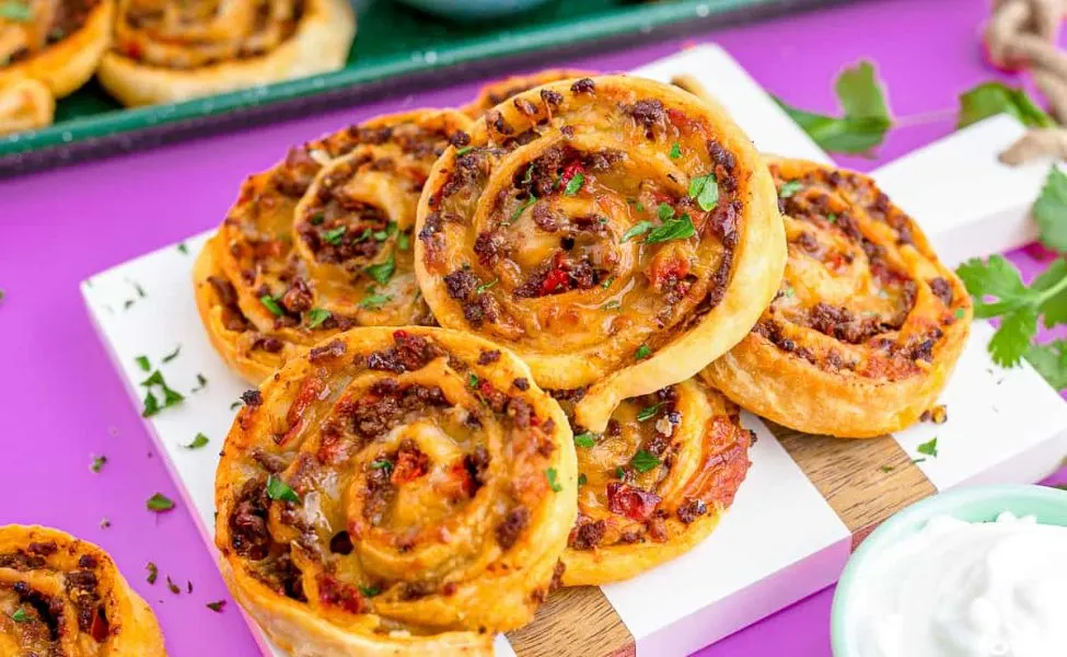 Pinwheels made of taco meat and cheese.