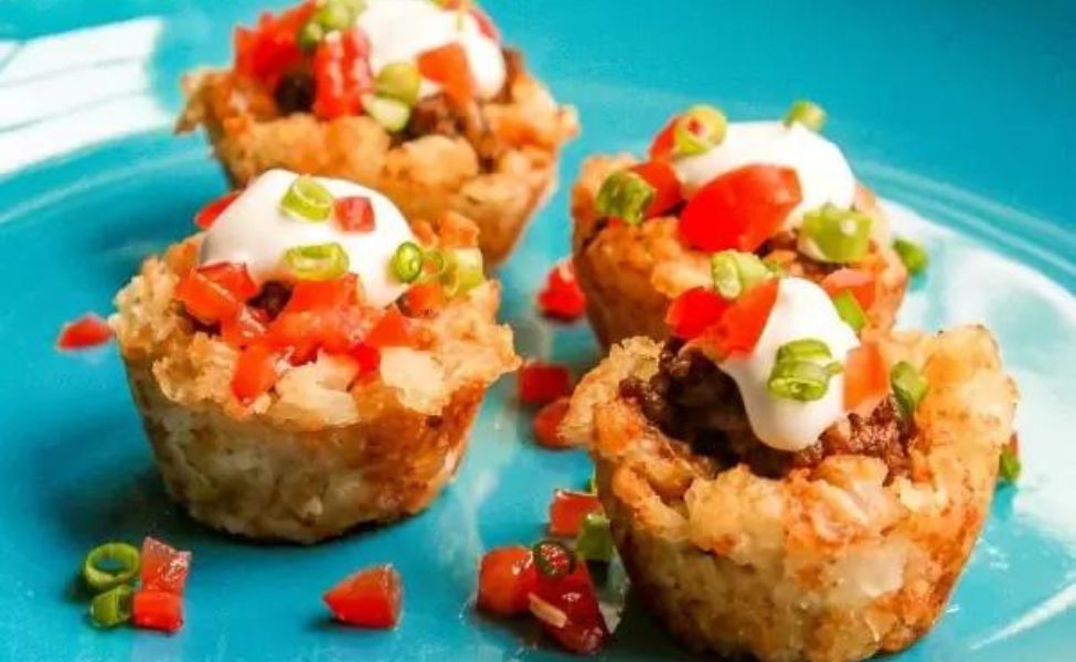  Tater tot cups filled with taco filling.