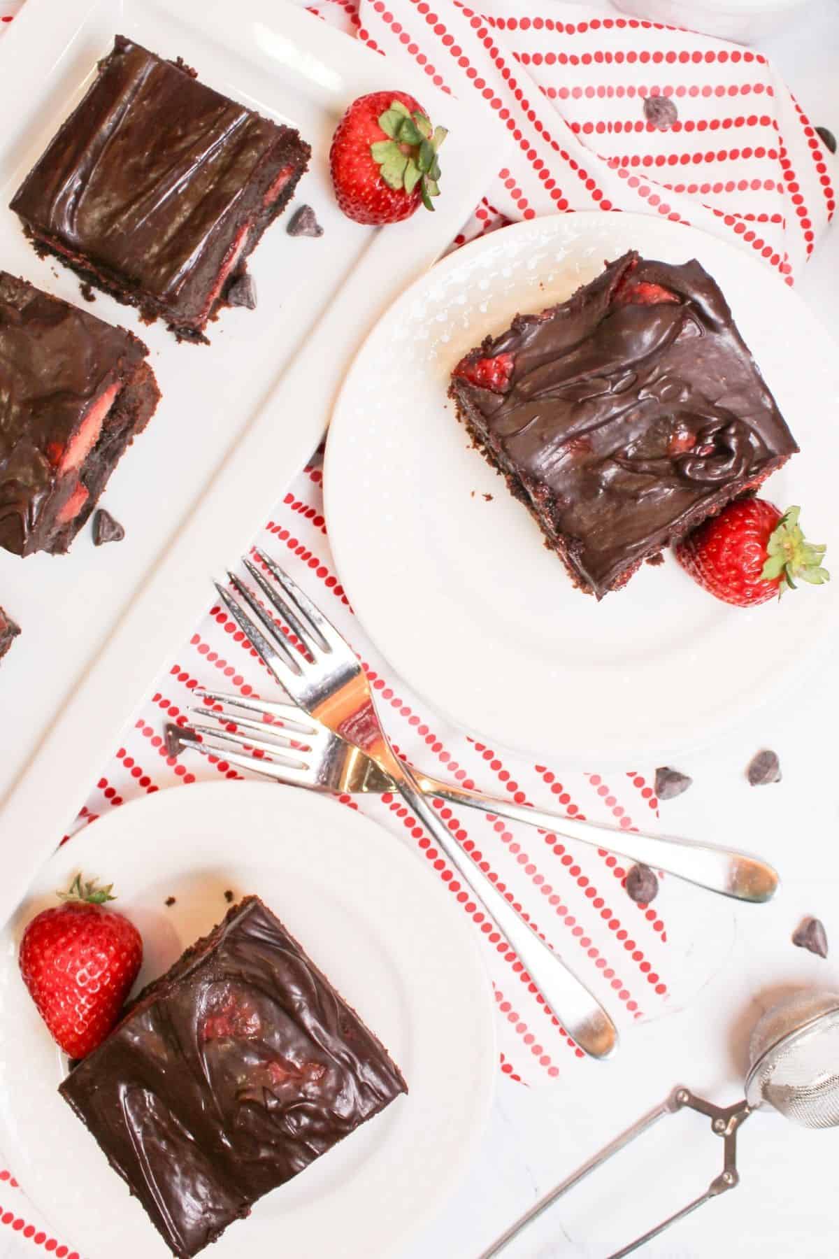 brownies photographed from above with strawberries